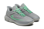 Pair of gray sneakers with mint-green laces and side emblems