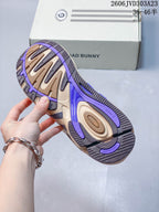 Close-up of the sneaker outsole with beige, dark gray and purple sections