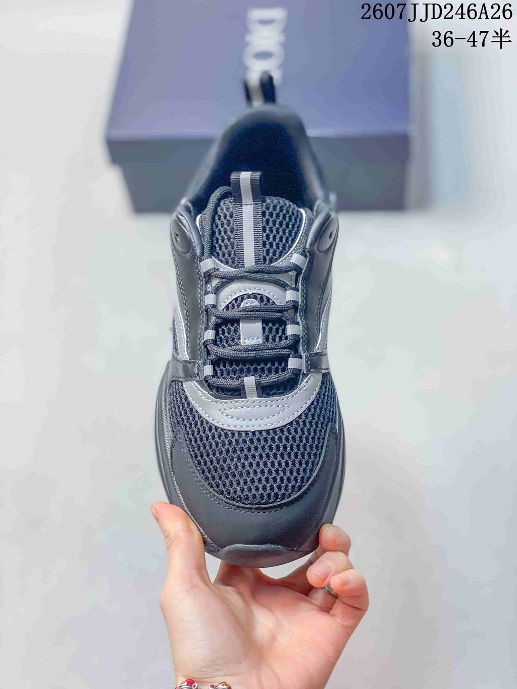 Top view of the sneaker showing the rounded toe, mesh-look vamp, contrasting overlays, and lace-up closure.