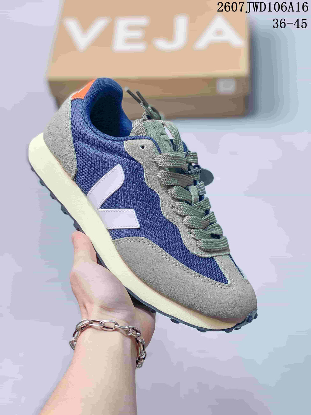Blue and gray VEJA Rio Branco sneaker with contrasting laces, suede-look panels and a cream-colored midsole.