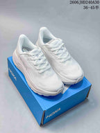 White HOKA Arahi 8 running shoes displayed on a blue shoe box