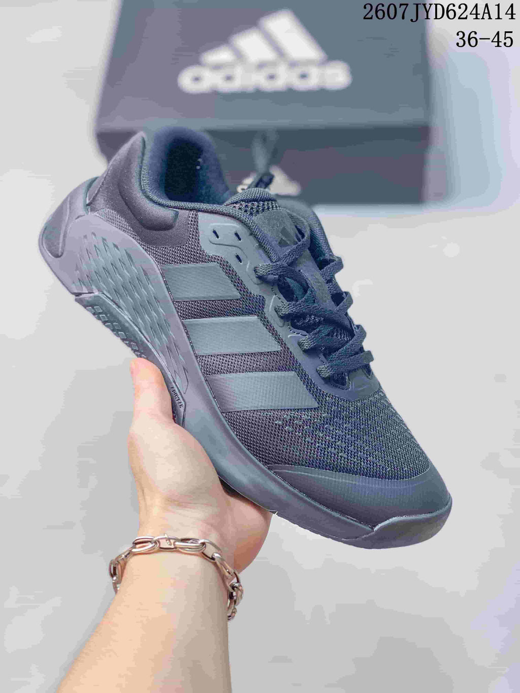 Dark gray adidas Dropset 4 training shoe shown from the side with a textured heel and outsole.