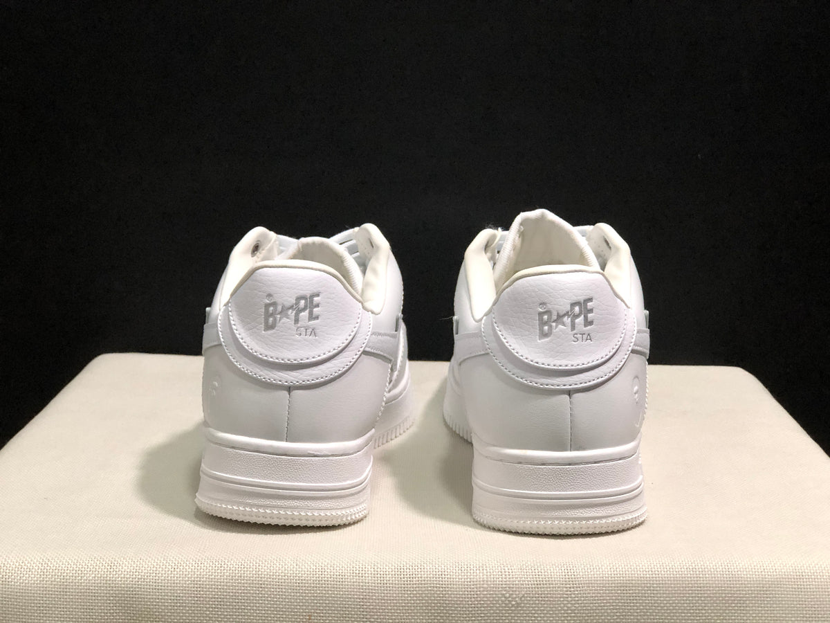 Rear view showing padded heel collars and BAPE STA branding on the heel tabs.