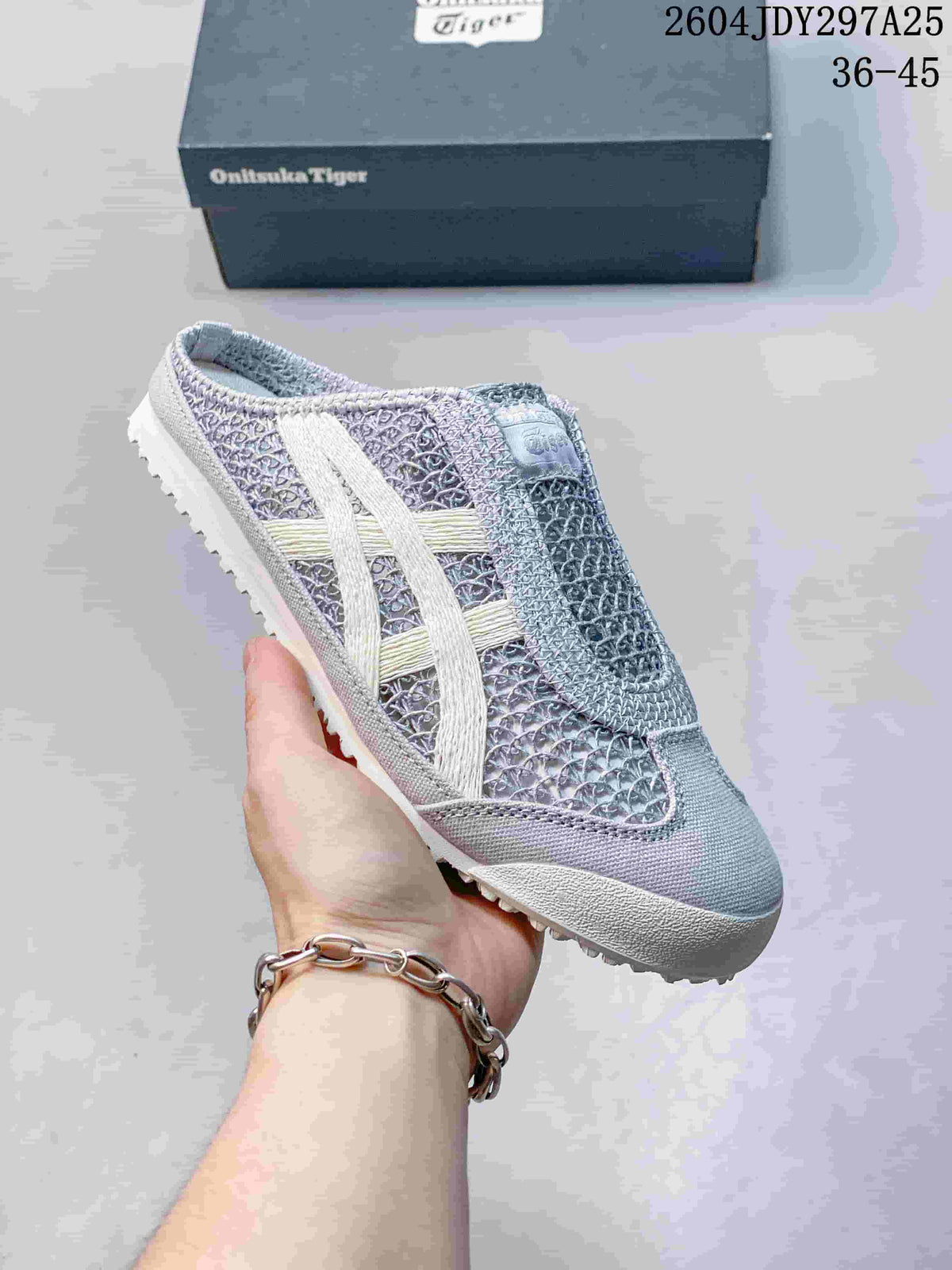 Angled side view of the gray and white Mexico 66 Sabot sneaker with its patterned upper and outsole.