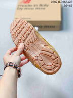 Close-up of the sneaker outsole showing a textured tread pattern and New Balance branding.