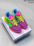 Pair of multicolor Nike JA 2 basketball shoes displayed on a shoebox, with purple, green, yellow and pink panels.