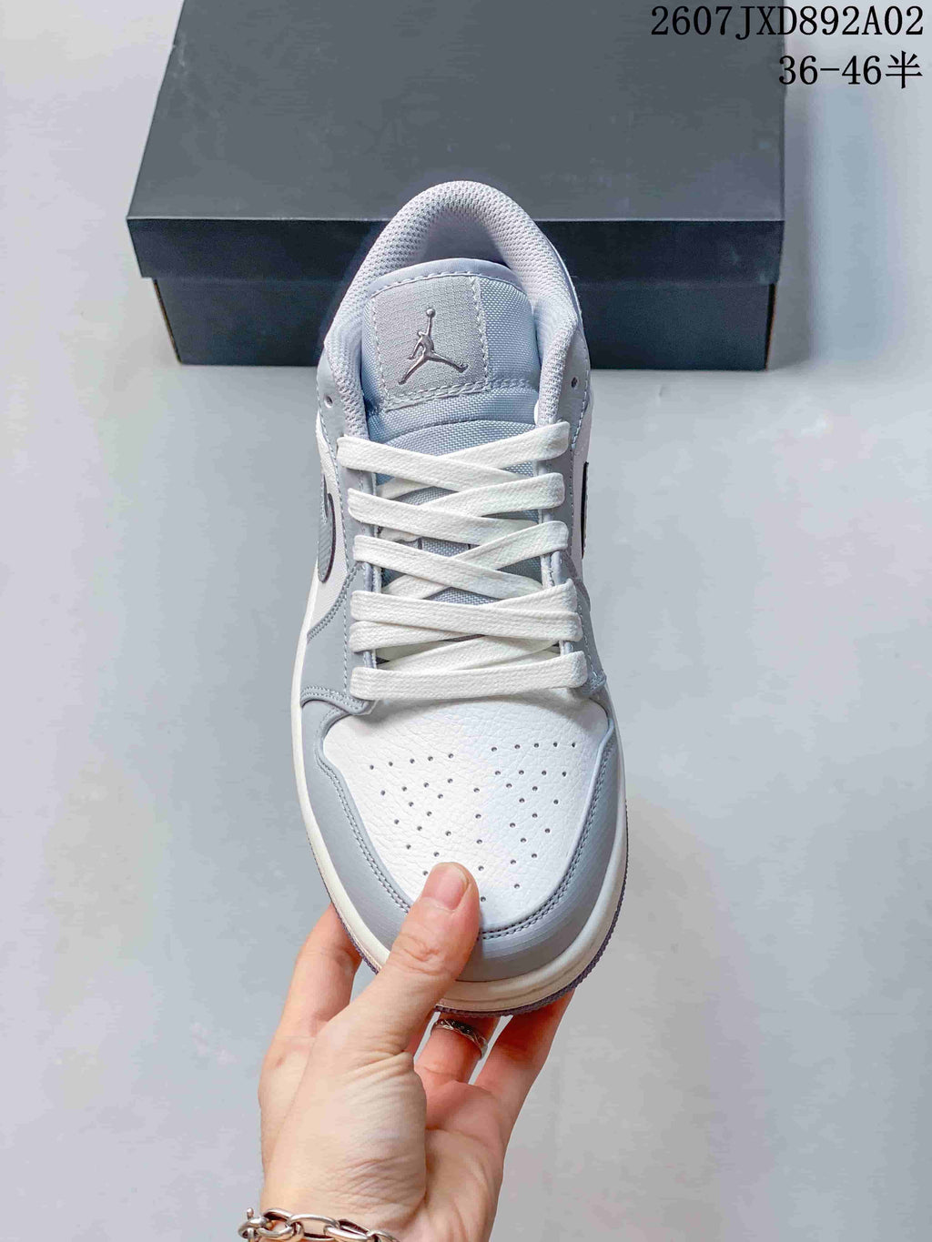 Top view showing the perforated toe, white laces, and tongue logo.