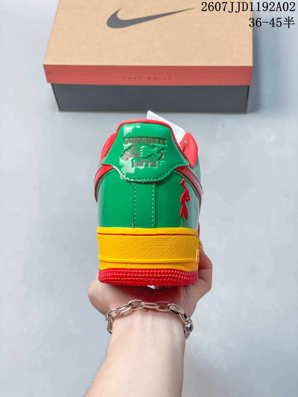 Rear view showing the green heel, yellow midsole, and red outsole