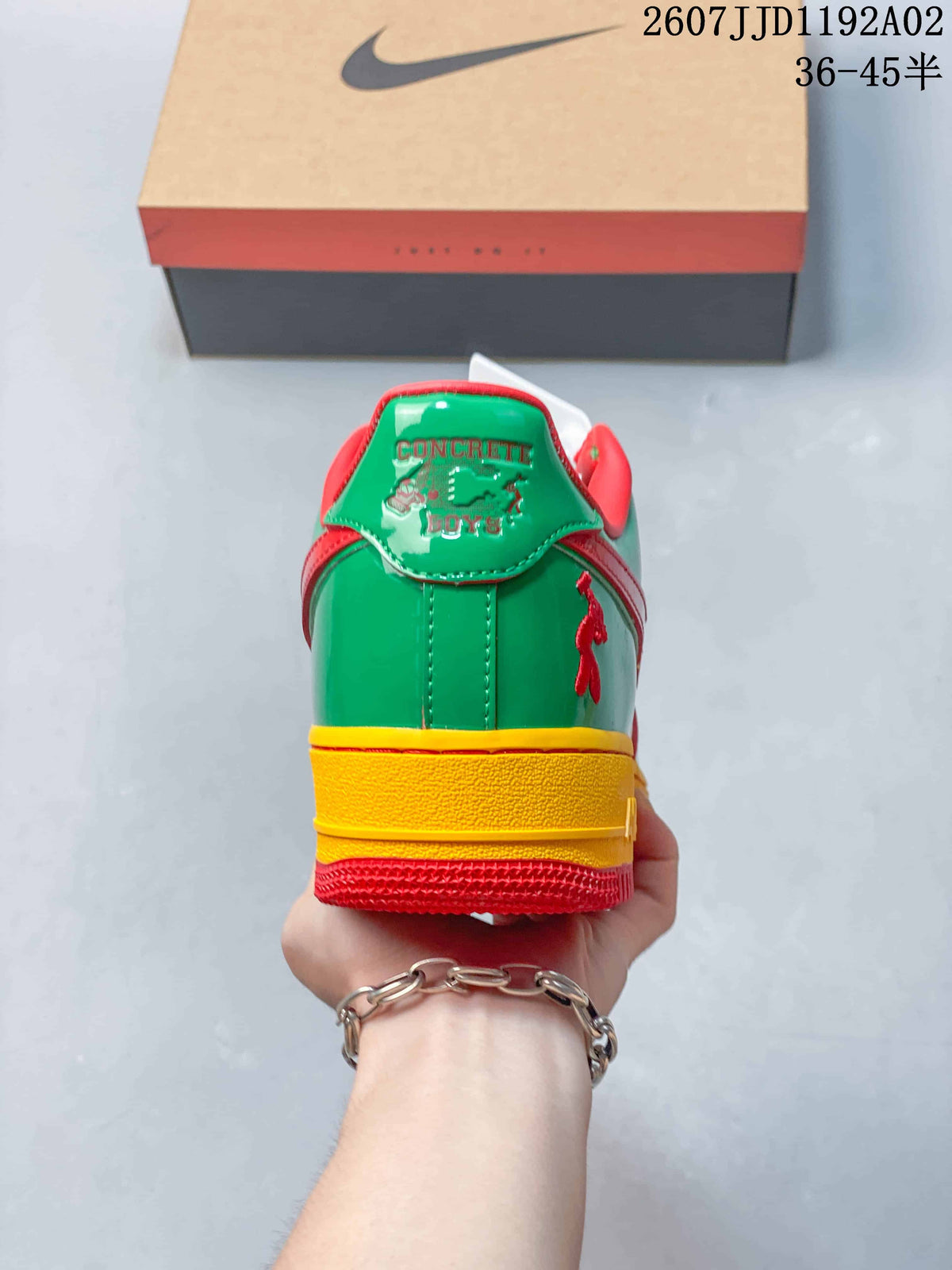 Rear view showing the green heel, yellow midsole, and red outsole