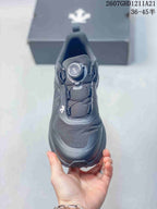 Top view of the black sneaker showing the BOA dial closure, padded tongue, and layered toe design.