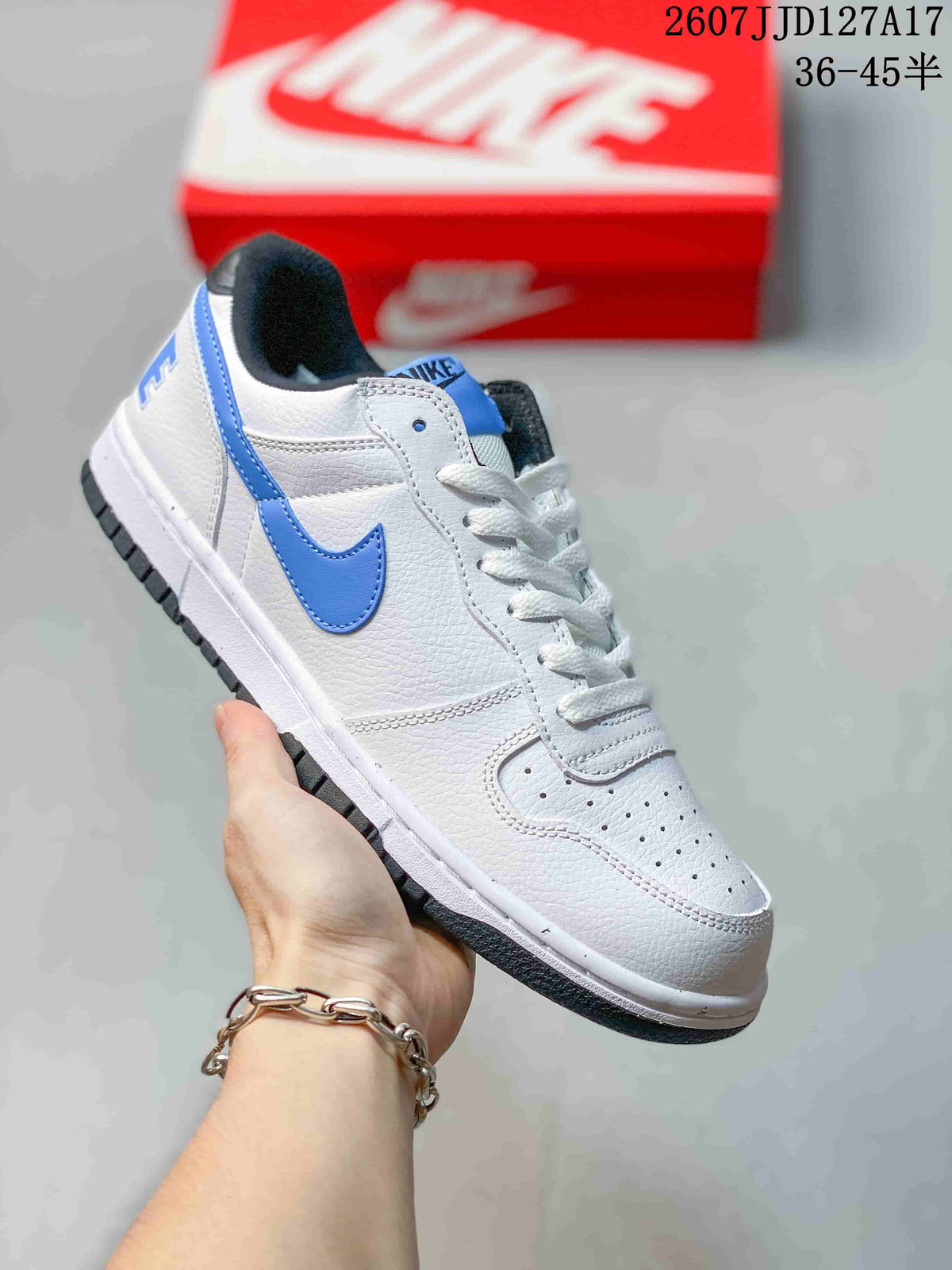 White Nike SB Dunk Low Pro sneaker with bright blue Swoosh, tongue, collar, and outsole accents.
