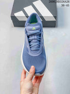 Top view of the blue lace-up shoe with lime-colored logo accents