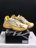 Pair of yellow, cream, and brown Off-White Be Right Back sneakers displayed on a branded shoe box.