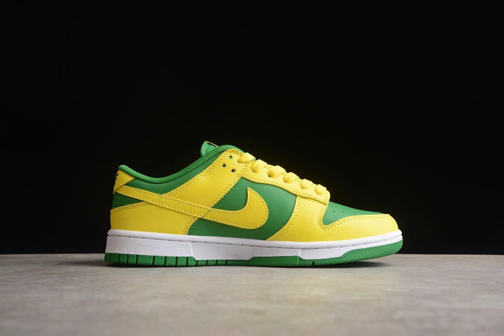 Side profile showing the yellow overlays, green panels, Nike Swoosh, and white midsole.
