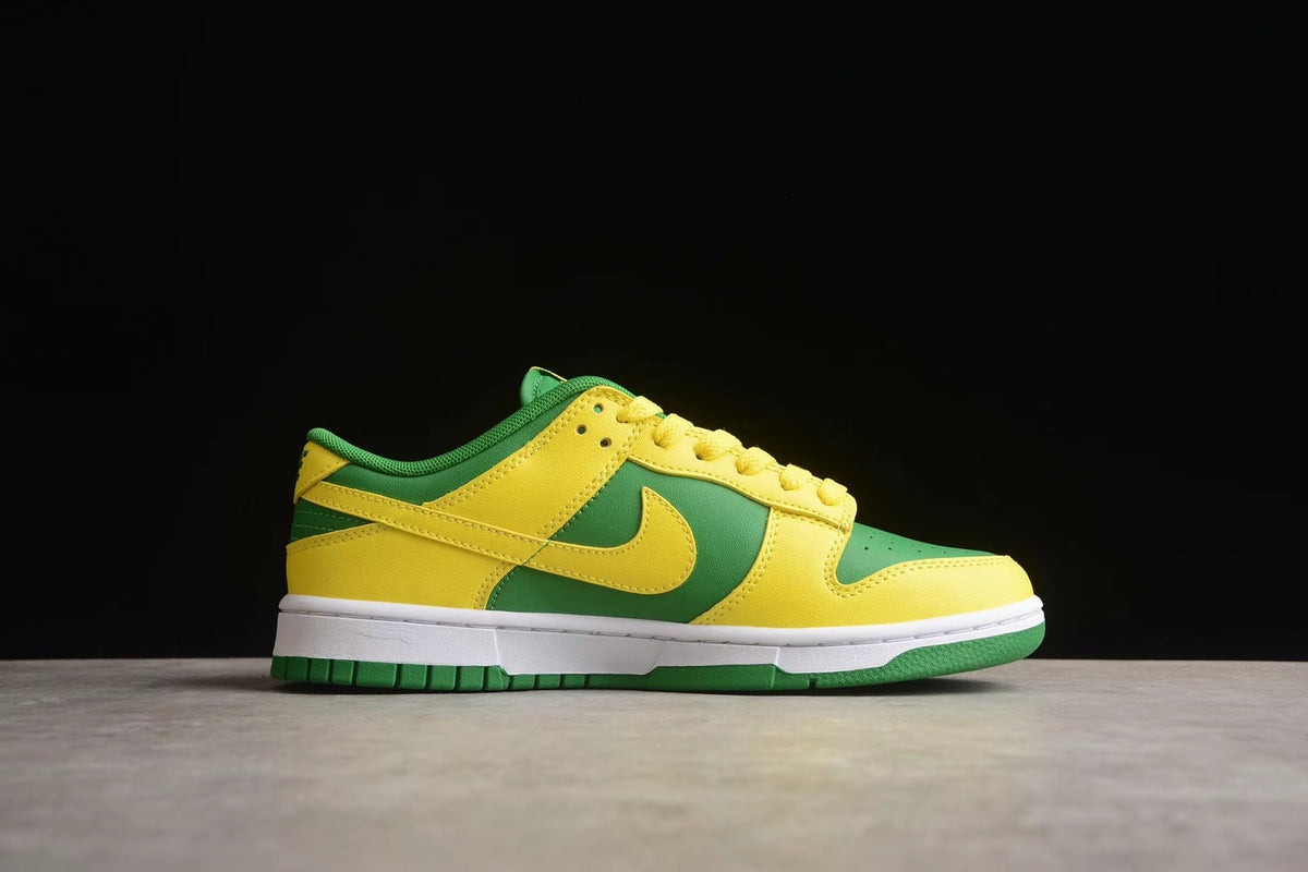 Side profile showing the yellow overlays, green panels, Nike Swoosh, and white midsole.