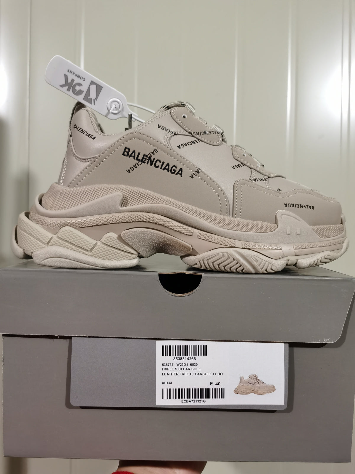 Khaki Balenciaga Triple S Clear Sole sneaker displayed on its branded box; the box label shows E 40.
