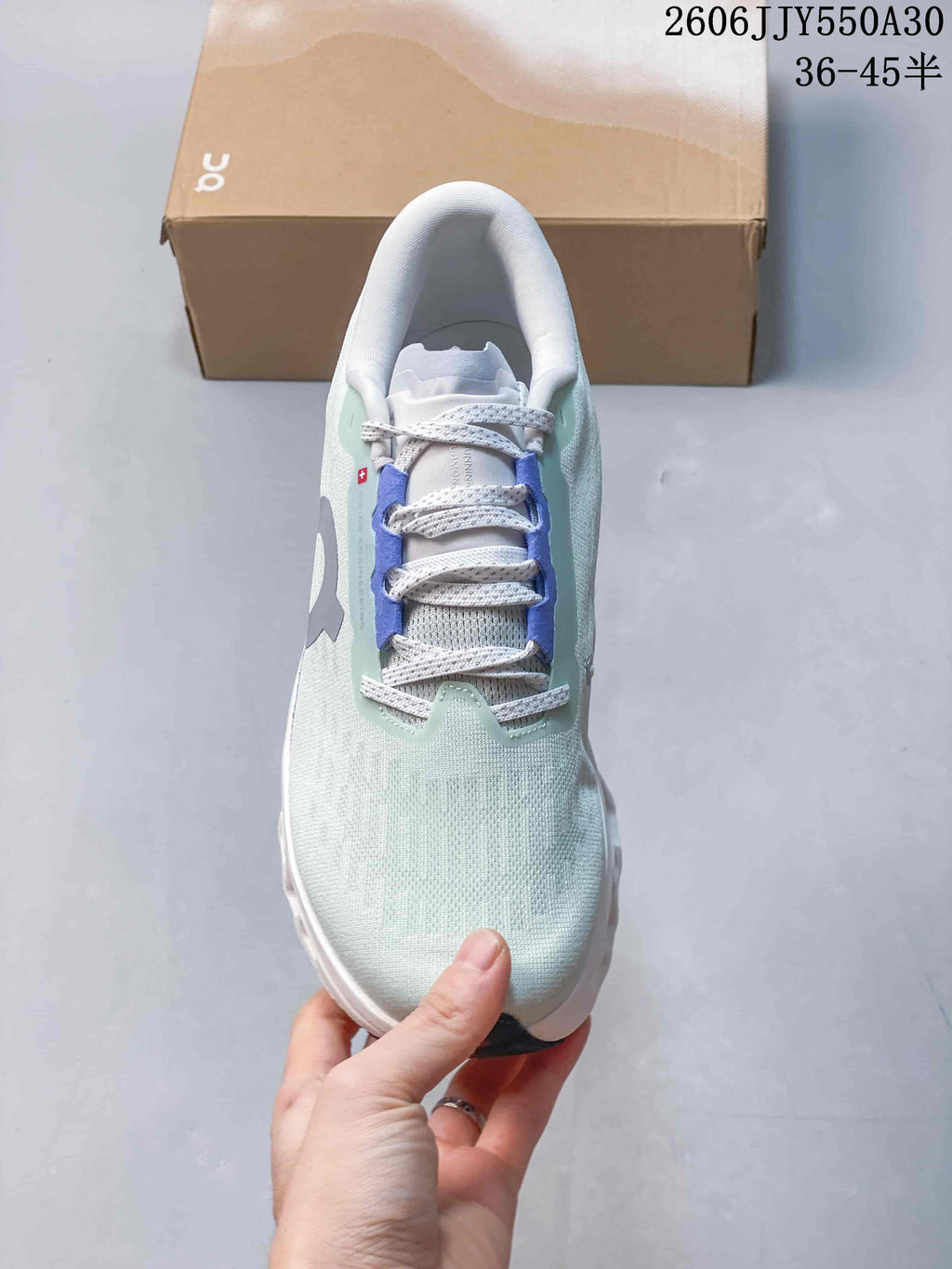 Top view of the shoe showing its lace-up front and pale mint upper