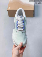 Top view of the shoe showing its lace-up front and pale mint upper