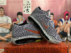 Angled view of the spotted Nike basketball shoes and their sole units