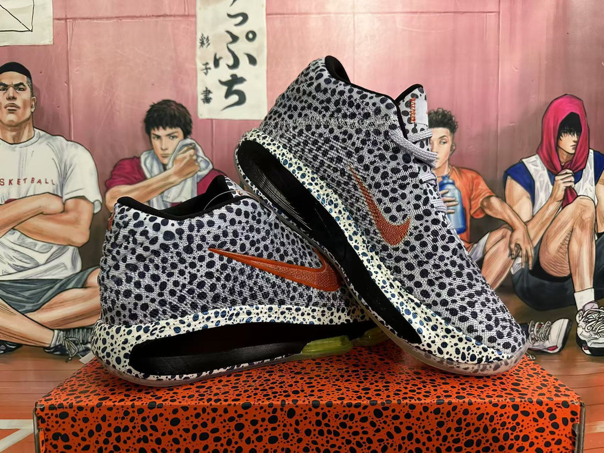 Angled view of the spotted Nike basketball shoes and their sole units