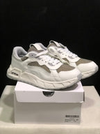 Pair of white and grey low-top sneakers displayed on a shoebox; the box label shows size 41.