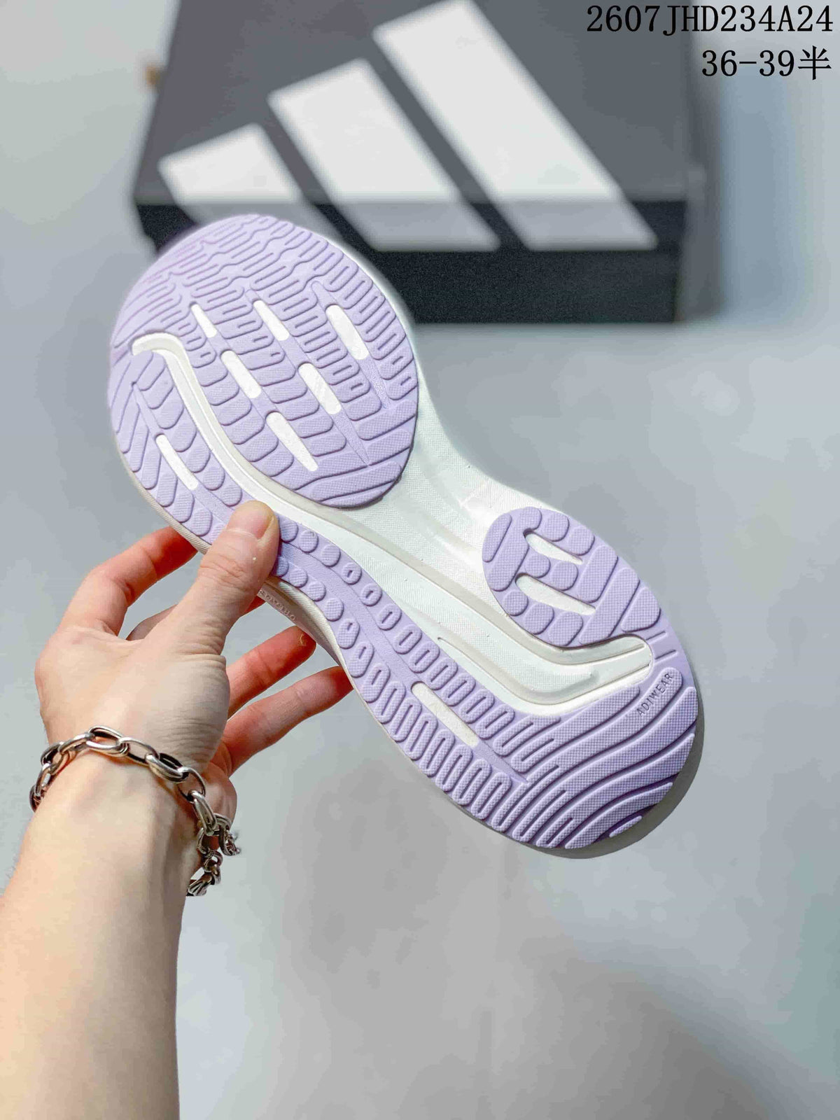 Bottom view showing the lavender-and-white patterned outsole and tread sections.