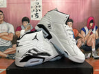 Pair of white and black high-top sneakers shown from angled side views.