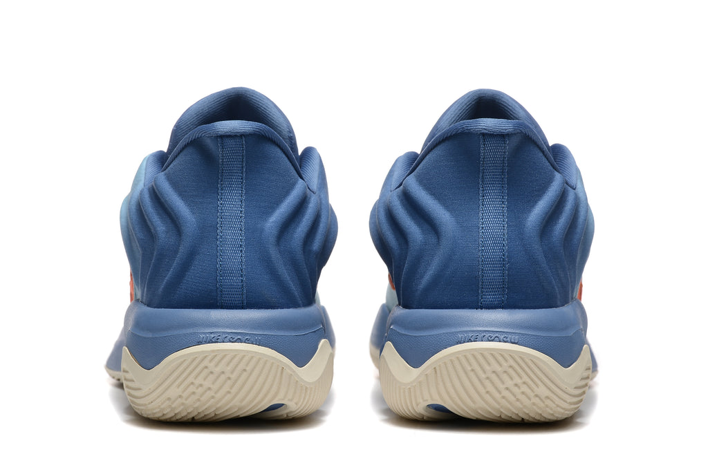 Rear view showing the blue heel sections and cream-colored outsoles