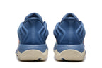 Rear view showing the blue heel sections and cream-colored outsoles