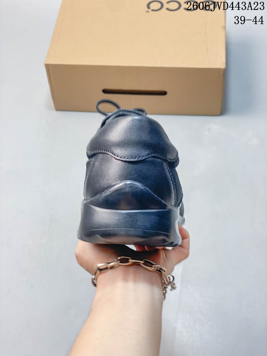 Rear view of the dark navy sneaker and heel