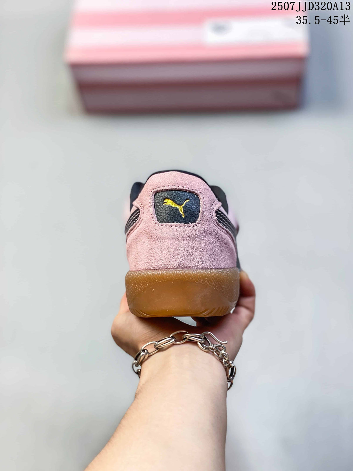 Rear view of the pink sneaker with a PUMA logo panel and gum-colored heel outsole.