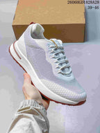 Angled side view of the sneaker with its white sole and dusty-rose tread.