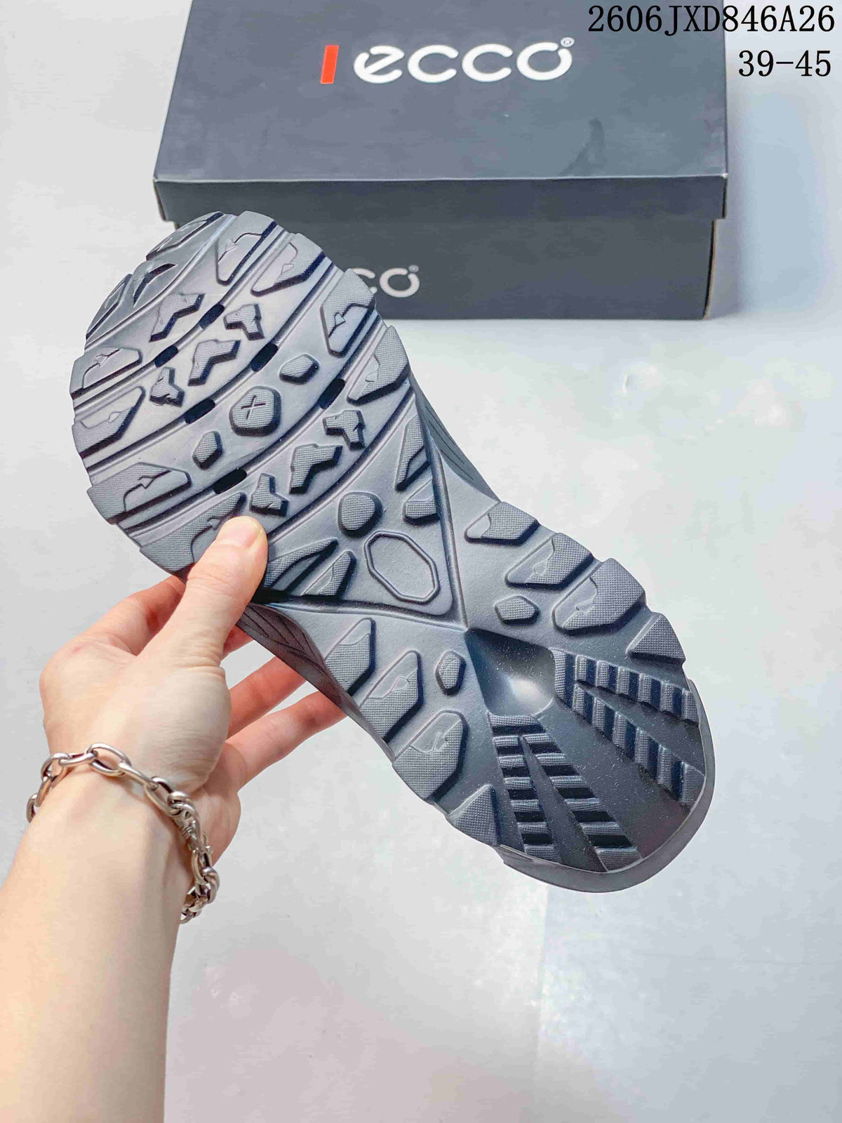 Close-up of the gray clog's patterned outsole and tread.
