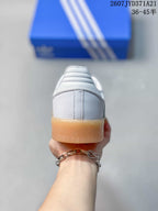 Rear view showing the white heel, padded collar, and gum-colored outsole.