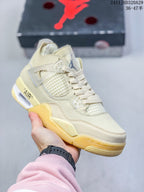 Close-up of a cream-colored sneaker showing mesh panels, lace wings, heel cushioning, and a translucent outsole.