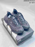Pair of dark gray Adidas Holo Peak low-top trail running shoes shown on a shoebox