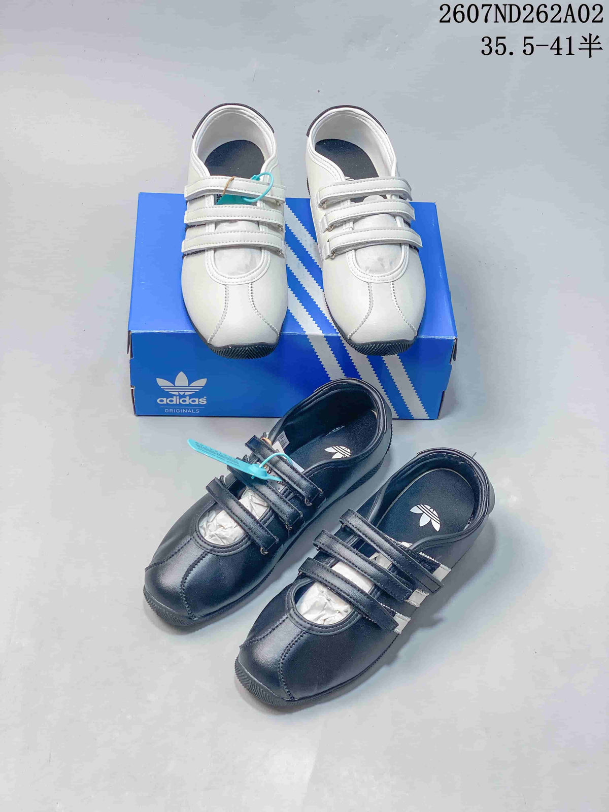 White and black adidas Originals ANFU Mary Jane shoes shown together.