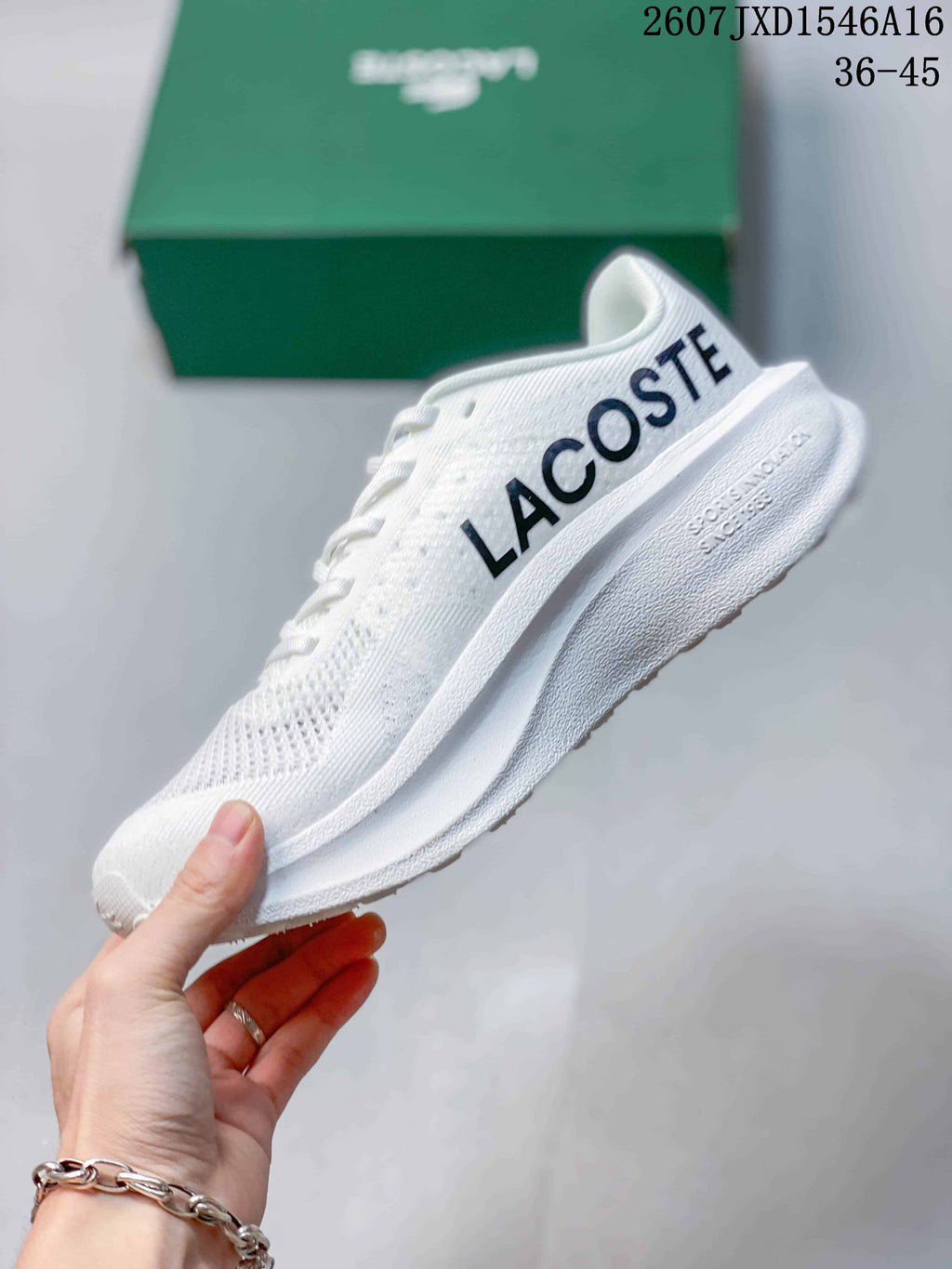 Side view of the white Lacoste sneaker showing large side branding, a low-profile shape, and a textured sole.