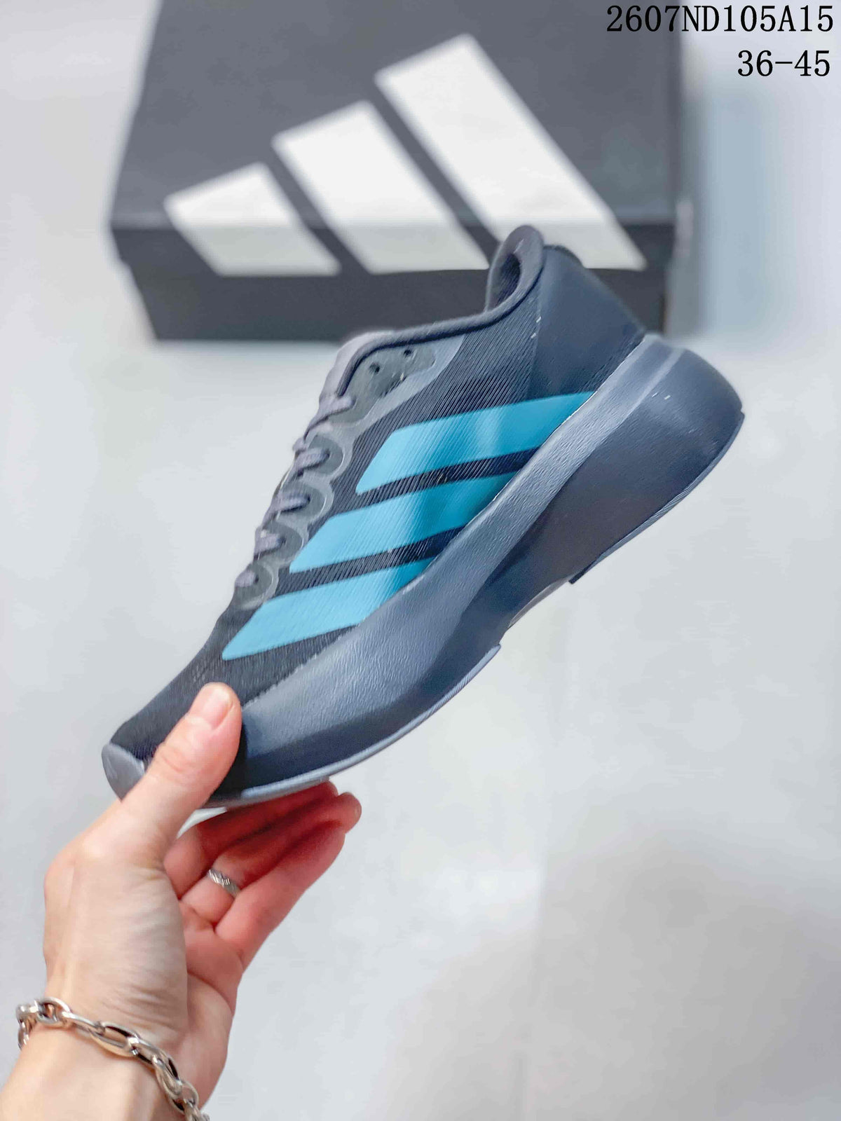 Side profile of the low-top sneaker showing its dark gray upper, bright blue stripes and raised sole.