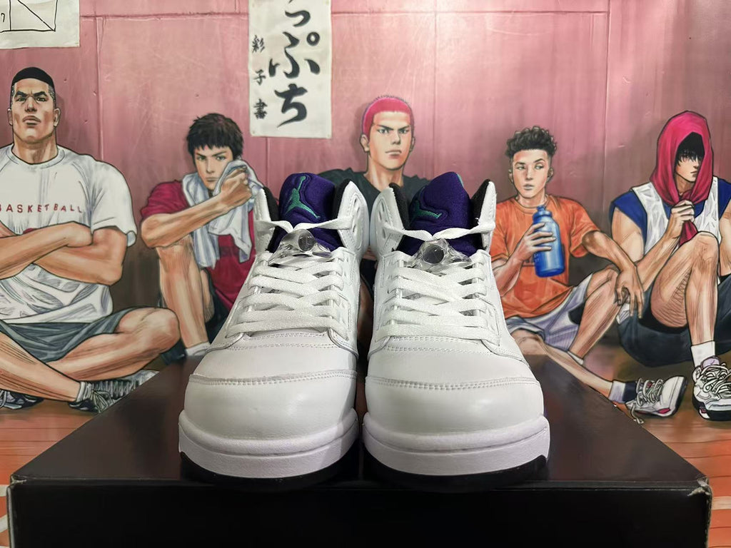Front view of white high-top sneakers with purple and teal tongue details