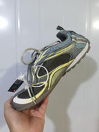 Top and side view of the Balenciaga Radar sneaker showing layered panels, mesh sections, and contrasting laces.