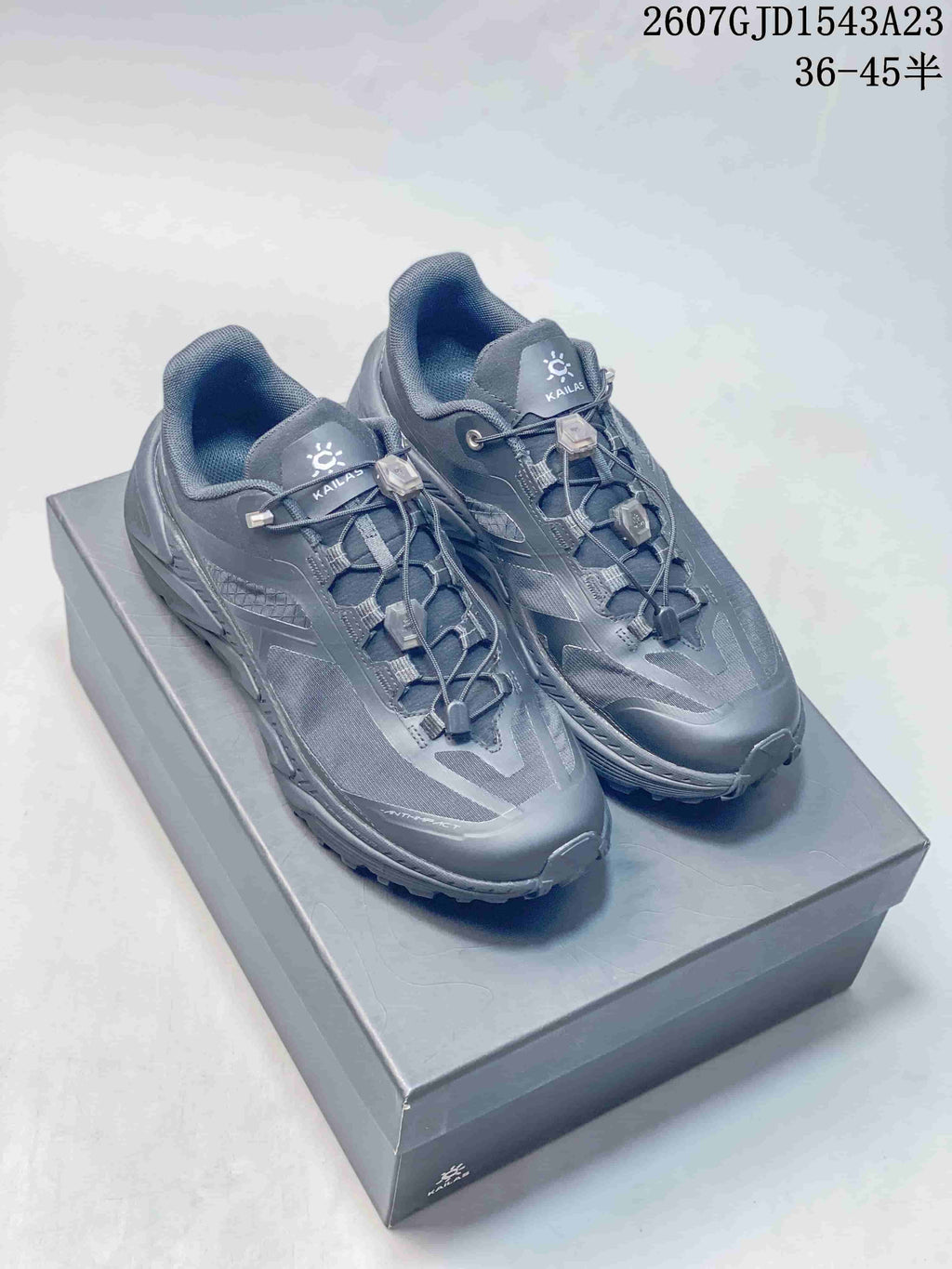Pair of dark gray KAILAS Shanhang 3 low-top sneakers displayed on a shoe box.