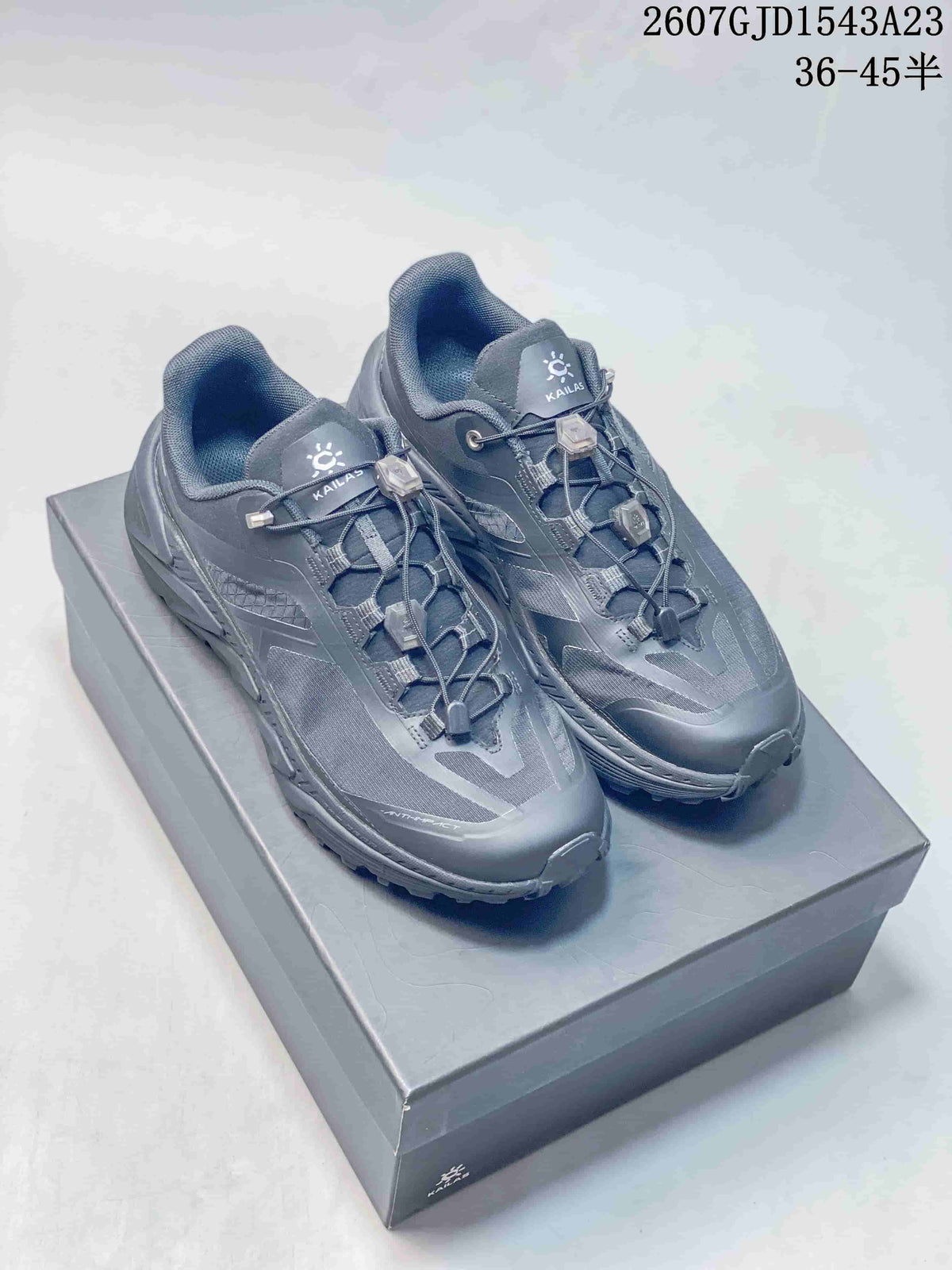 Pair of dark gray KAILAS Shanhang 3 low-top sneakers displayed on a shoe box.