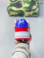 Rear view showing the blue heel tab, BAPE STA tongue branding, red heel panel, and white midsole.