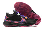 Black basketball shoes with a multicolor patterned Swoosh and pink patterned outsole.