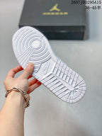 Close-up of the white patterned rubber outsole with circular traction details and visible Nike branding.