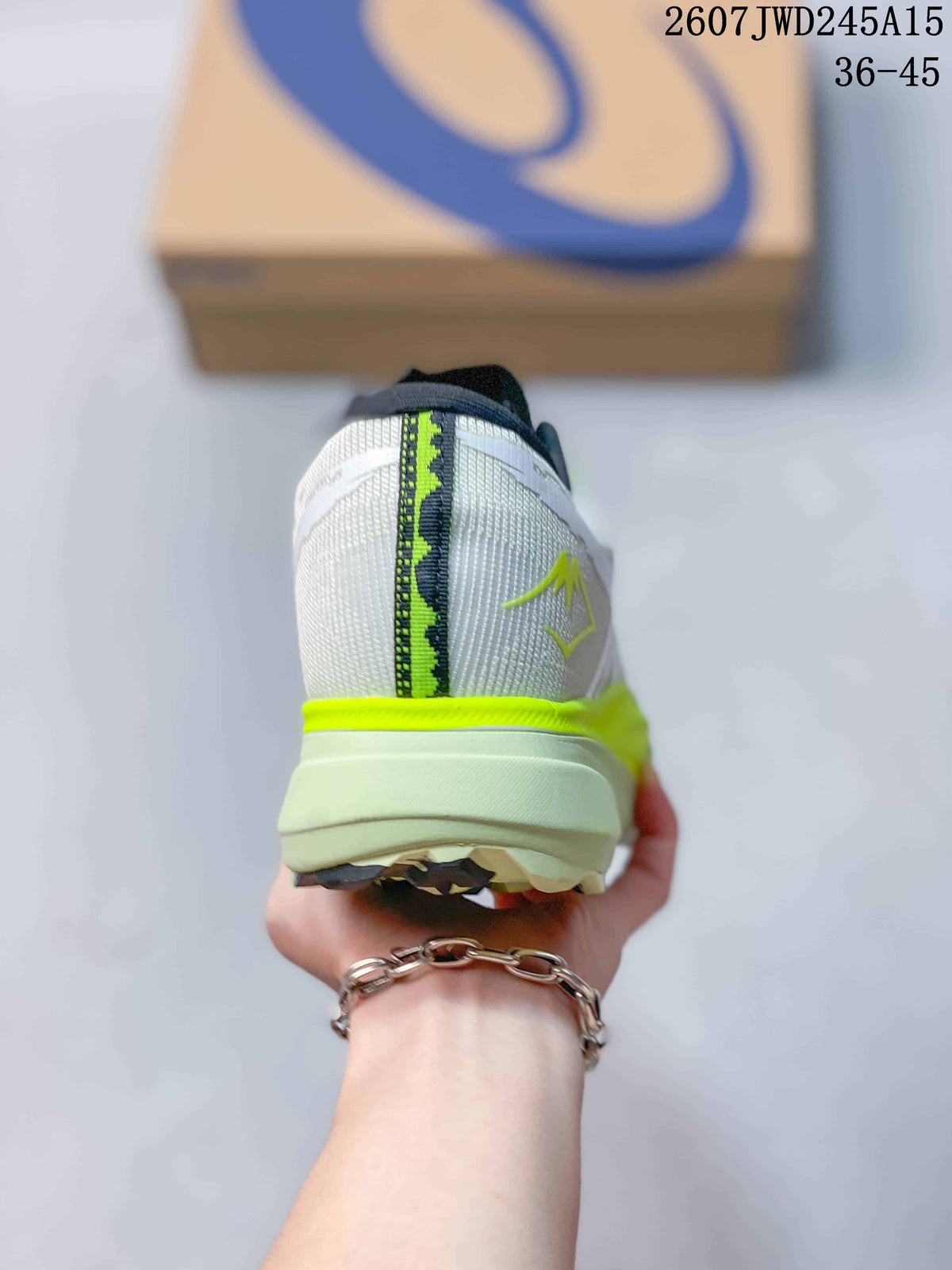 Rear view of the white sneaker showing the heel structure, neon yellow trim, and contrasting center stripe.