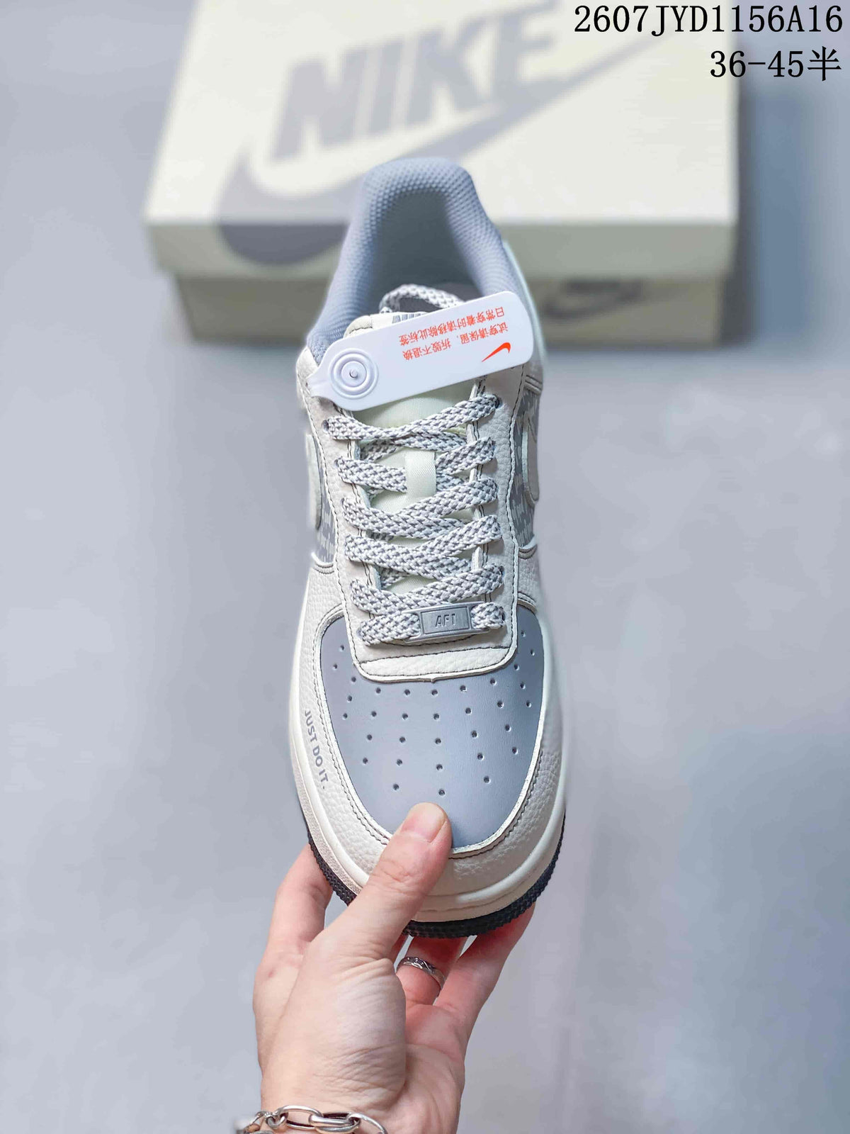 Top view showing the perforated blue-grey toe box, patterned laces, tongue and padded collar.
