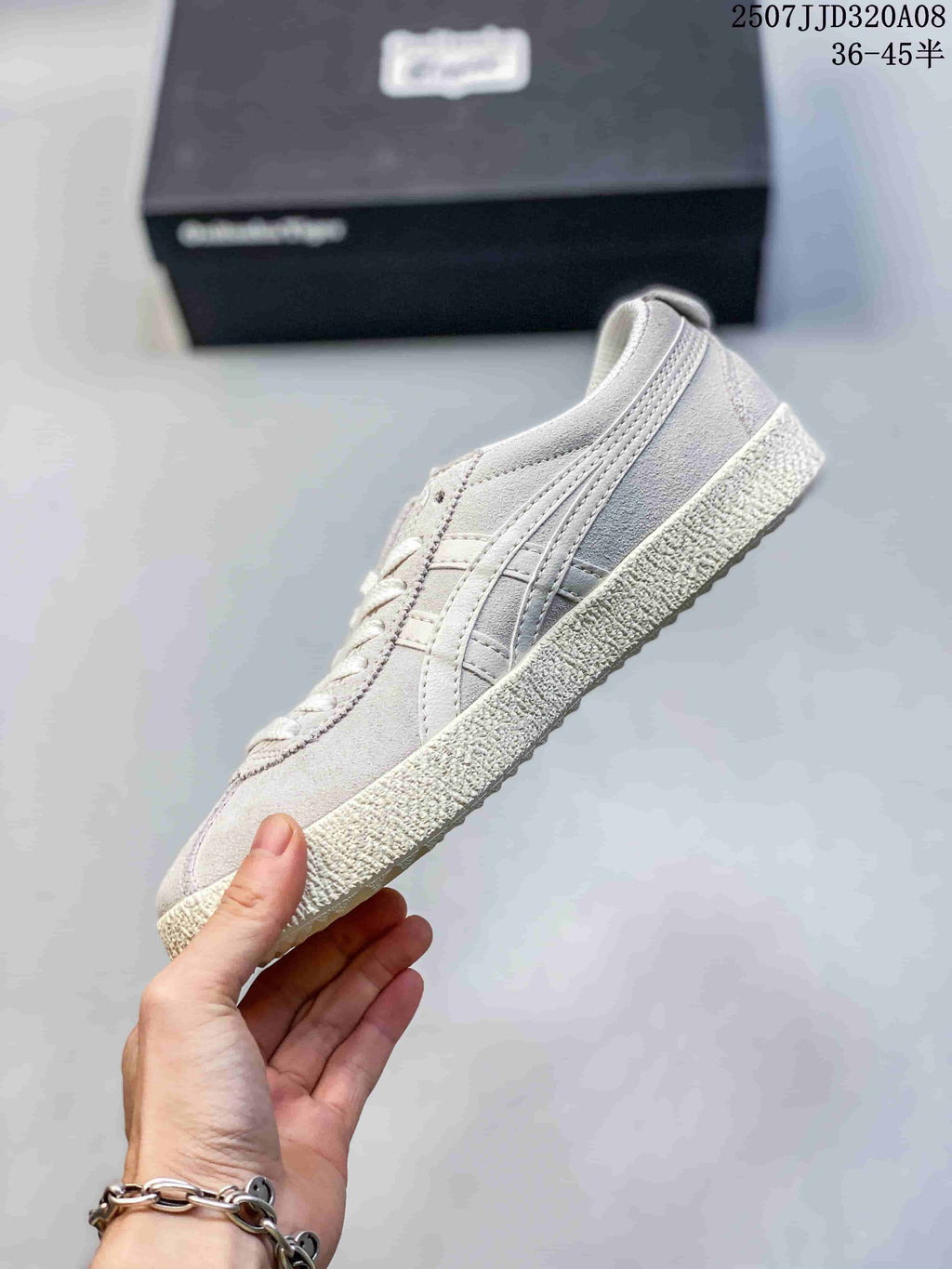 Side profile of a light gray ASICS Japan S sneaker showing the layered side stripes, low-top shape, and textured outsole.