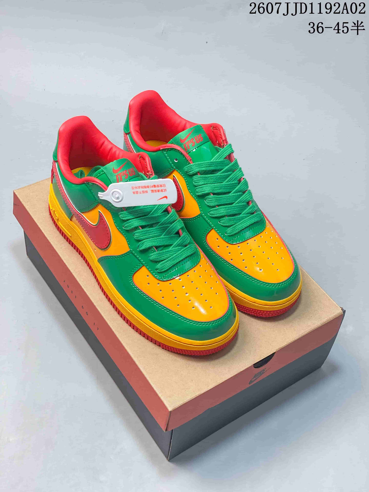 Pair of vivid green, yellow and red low-top sneakers with lace-up fronts and perforated toe panels.
